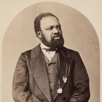 <div class="ira-title">Ira Aldridge</div>
<div class="ira-detail">photograph; date and location unknown</div>
<div class="ira-detail"><a href="http://www.hcl.harvard.edu/libraries/houghton/collections/htc/" target="_blank" rel="noopener noreferrer">Harvard Theatre Collection, Houghton Library, Harvard University</a></div>
<div class="ira-reference"><a href="http://id.lib.harvard.edu/via/olvwork604691/catalog" target="_blank" rel="noopener noreferrer">TCS 1.249</a></div>
<div class="ira-comment">In this photograph, one of the few taken of Aldridge out of theatrical costume, he wears two of his medals. Here, as often elsewhere, he is referred to as “the African Roscius,” a title he started using early in his career. Roscius was the name of a famous Roman actor whose talent helped him earn freedom from slavery; he died in 62 <span style='font-size:90%;'>BCE</span>. Celebrity (and “wanna-be” celebrity) actors often adopted the title of “Roscius”: child actors were sometimes labeled “Young Roscius” or “Infant Roscius” and there was at least one actress referred to as “the Female Roscius.” By calling himself the “African Roscius,” Aldridge also helped to reinforce his invented family history as Senegalese royalty.</div>
<a href="https://www.chesapeakeshakespeare.com/ira/exhibit/ira-img-22" target="_blank" rel="noopener noreferrer"><div class="ira-osdlink"><img src="https://www.chesapeakeshakespeare.com/wp-content/uploads/openseadragon-small.png" style="width:32px;height:32px;">Zoom</div></a>