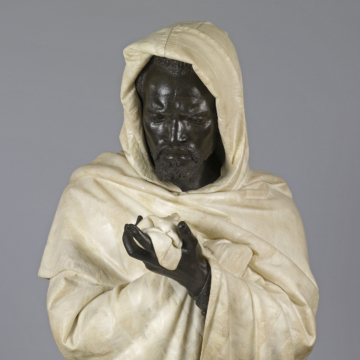 <div class="ira-title"><i>Othello</i></div>
<div class="ira-detail">Pietro Calvi (Italian, 1833–1884)</div>
<div class="ira-detail">ca. 1873</div>
<div class="ira-detail">marble and bronze, approx. 34<sup>5</sup>⁄<sub>8</sub> × 22<sup>1</sup>⁄<sub>16</sub> × 22<sup>13</sup>⁄<sub>16</sub> in.</div>
<div class="ira-detail"><a href="https://thewalters.org/" target="_blank" rel="noopener noreferrer">The Walters Art Museum, Baltimore</a></div>
<div class="ira-reference"><a href="http://art.thewalters.org/detail/98789/" target="_blank" rel="noopener noreferrer">27.609</a></div>
<div class="ira-comment">This life-size bust represents Othello, holding his wife’s handkerchief at the moment he realizes that she is innocent. Note the tear on his cheek. At a time when nineteenth-century artworks in the “orientalist” or “ethnographic” tradition often depicted Asian or African people as exotic, lazy, or savage types, Calvi produced a thoughtful, emotional portrait of an individual. Although it was crafted shortly after Aldridge’s death, it was almost certainly inspired by Aldridge. Aldridge’s image had circulated widely in print; he was famous across Europe as the pre-eminent African-American actor and most recognizable actor to play Othello.</div>
<a href="https://www.chesapeakeshakespeare.com/ira/exhibit/ira-img-23" target="_blank" rel="noopener noreferrer"><div class="ira-osdlink"><img src="https://www.chesapeakeshakespeare.com/wp-content/uploads/openseadragon-small.png" style="width:32px;height:32px;"></div></a>